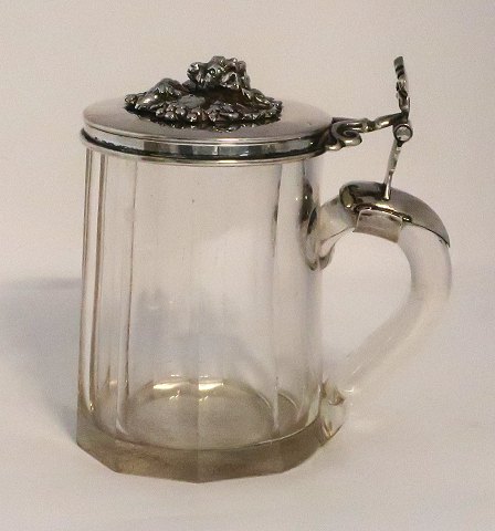 Glass mug with silver lid (830). Height 11 cm. Diameter 7 cm.