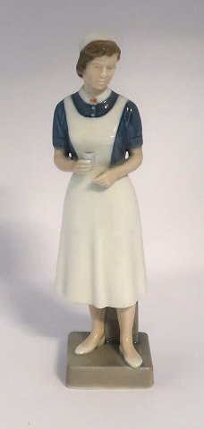 Royal Copenhagen. Porcelain figure. Nurse. Model 4507. Height 21.5 cm. (1 
quality).