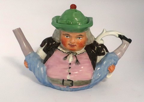 Royal Copenhagen. Teapot in the shape of a man. Hat is the lid, and legs are the 
spout and handle. Length 24 cm. Height 16 cm. Produced before 1900. Supposed to 
have been made by Princess Marie, married to Prince Valdemar.