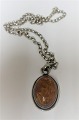 Silver pendant with amber. (925). Necklace included (925).