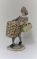 Bing & Grondahl. Porcelain figure 8045. Man with Fruit basket. Design: Tegner. 
Height 18 cm. (1 quality)