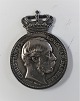 Silver (925). Royal bookmark mounted with the reverse of the commemorative 
medal. The fabric is missing. Provenance Sorgenfri slot