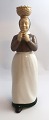 Bing & Grondahl. Porcelain figure. The woman with the eggs. Model 2126. Height 
22 cm. (1 quality)