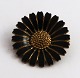 Kundby, Copenhagen (O.C.K). Daisy brooch sterling silver with black enamel 
(925). Diameter 3 cm.