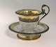 French crystal cup with silver gilt mounting. Cup and saucer. Height 13 cm. 
Minor edge chip on the underside of the cup.