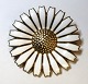 Georg Jensen. Daisy brooch sterling silver with white enamel (925). Diameter 4,2 
cm.