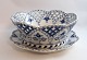 Royal Copenhagen. Blue fluted, full lace. Round fruit bowl with saucer. Model (1061 1062). Diameter of the bowl is 23 cm. Height 9 cm. Diameter of the saucer 25 cm. (1 quality). Produced before 1923